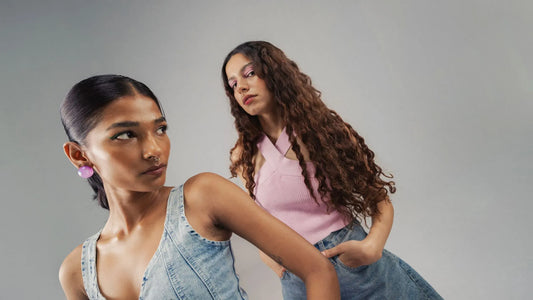 A person applying styling gel to enhance defined curls, showcasing effective curl care techniques.