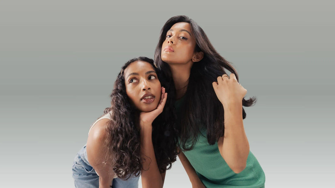 A person demonstrating proper hair brushing techniques with a wide-tooth comb in a bright bathroom.