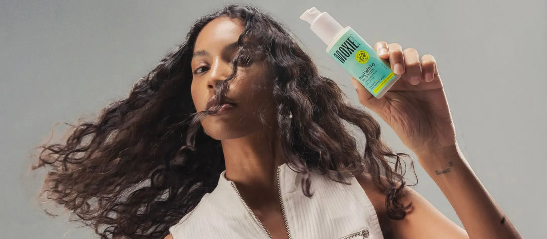 Woman applying natural hair mask to strengthen and thicken her hair for healthier growth.