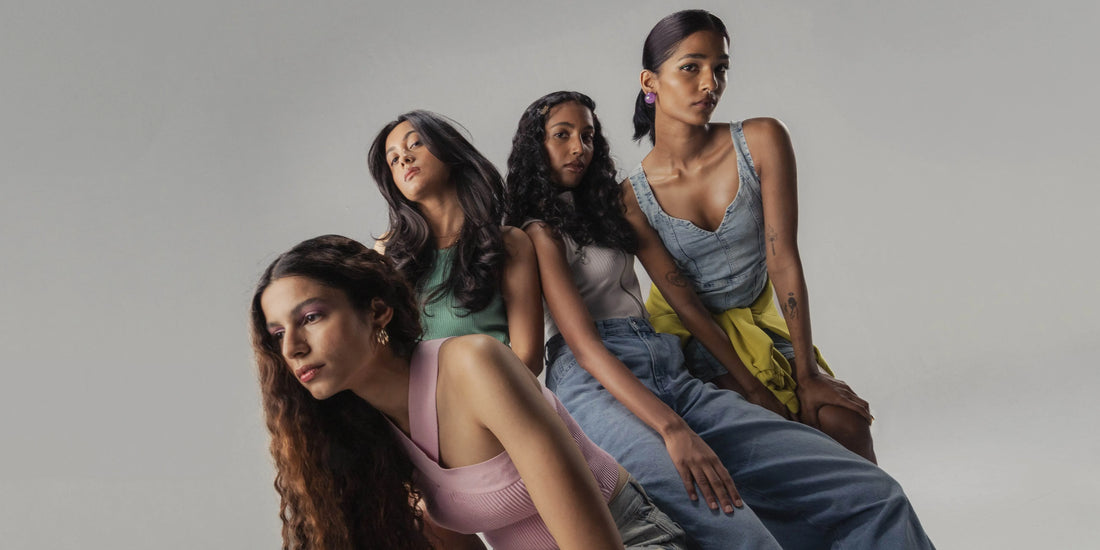 Indian woman contemplating hair dye colors, showcasing vibrant shades suitable for Indian skin tones.