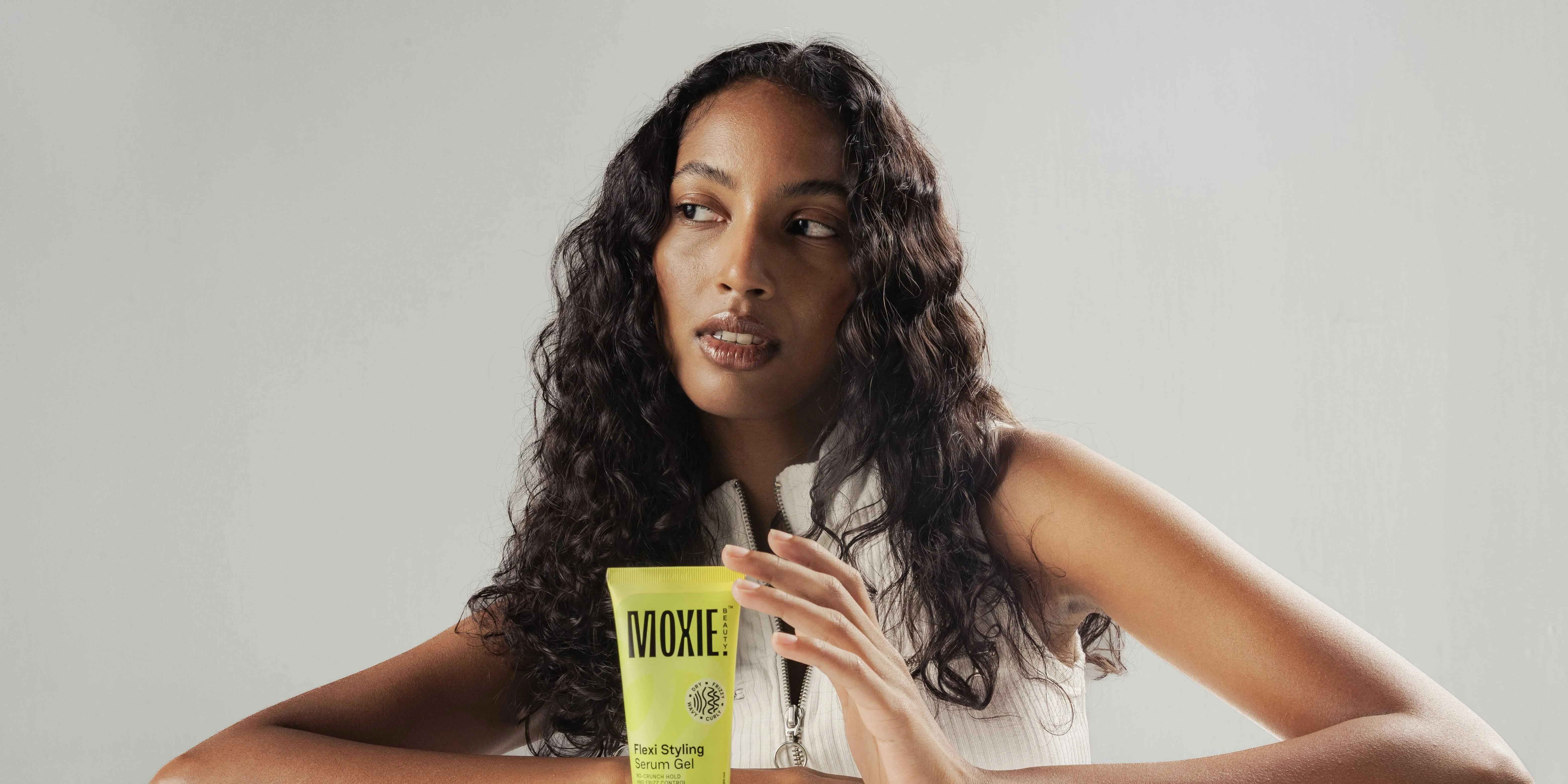 A woman with thin hair applying Bounce Curl products, showcasing healthy, defined curls and volume.