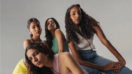 A woman applying a nourishing hair mask to repair damaged hair effectively at home.