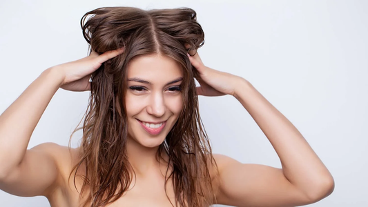 Woman running hands through damp hair