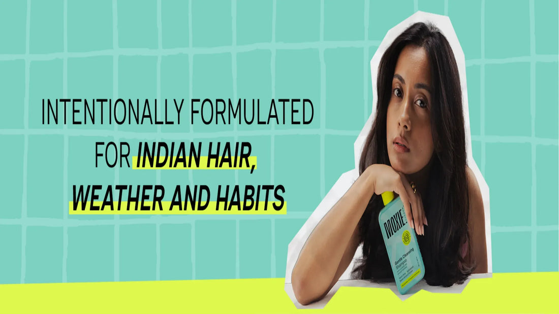 A woman showcasing elegant Indian hairstyles for long hair, featuring braids and traditional accessories.